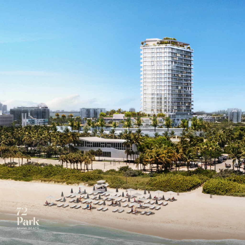 An aerial architectural rendering of 72 Park, a tall, modern white luxury condominium tower in Miami Beach. The building features wrap-around glass balconies and a lushly landscaped amenity deck. In the foreground, a sandy beach is dotted with white umbrellas and lounge chairs, bordered by tropical palm trees and the blue waters of the ocean.