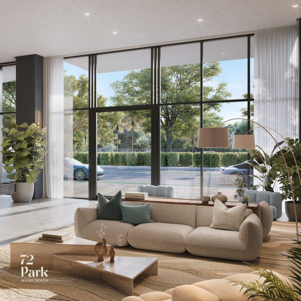 An interior rendering of the sun-drenched, high-ceilinged lobby at 72 Park. The space features a curved, beige bouclé sofa, minimalist wooden coffee tables, and a large arched floor lamp. Massive glass walls overlook a street lined with tropical trees, while the interior is decorated with large potted plants and textured neutral-colored rugs.